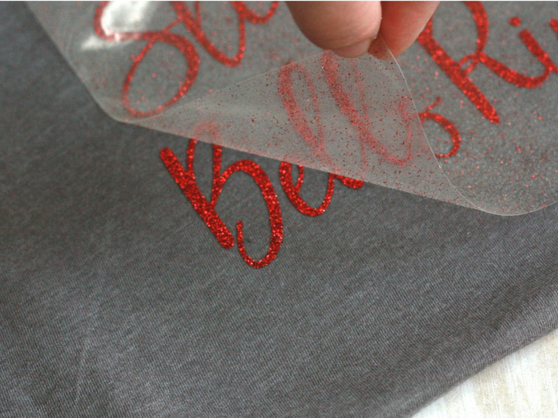 Peeling off the protective backing on Cricut Iron-on material