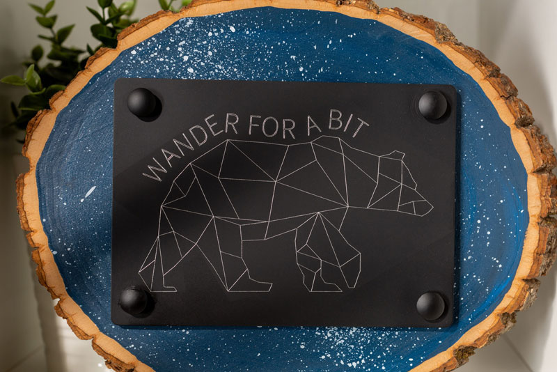 "Wander for a bit" Cricut engraving project