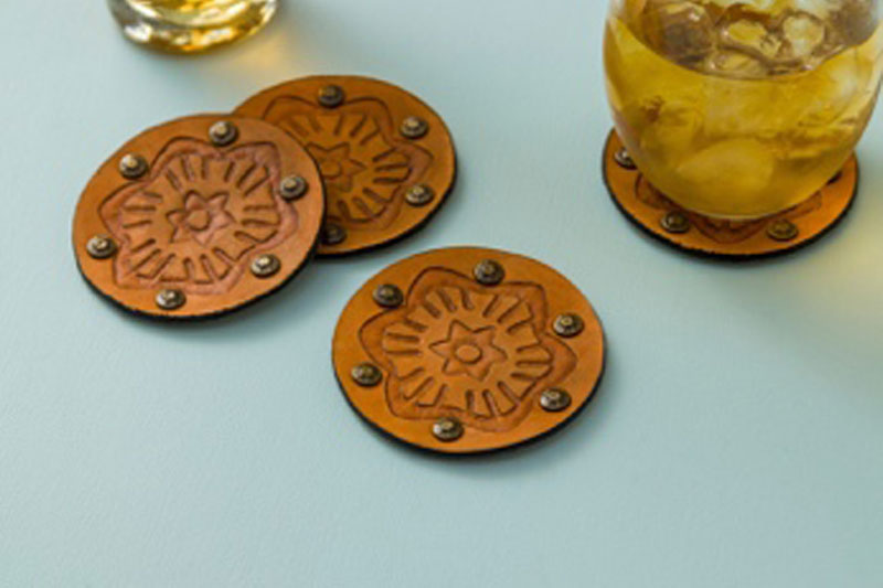 Debossed Cricut coasters with floral design made with Cricut Maker tools.