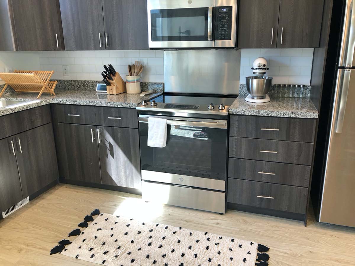 Faux subway tile backsplash in kitchen cut with a Cricut machine