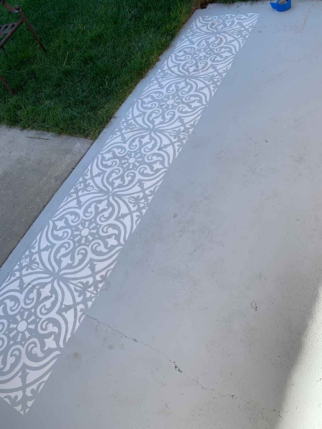 one row of concrete rug created with Cricut stencil completed