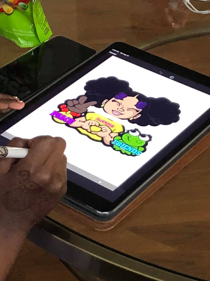 Jamesha Bazemore illustrating on her tablet device for Cocoa Twins artwork