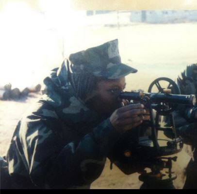 Jamesha Bazemore while stations in Iwakuni, Japan using an Autolevel, an antique surveying tool.