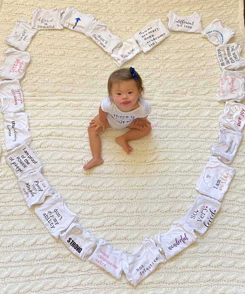 Baby Arabella with heart of onesies