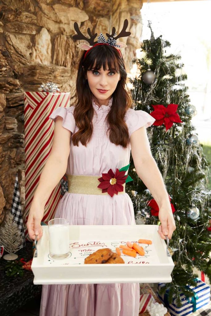 Zooey Deschanel with #CricutMade reindeer antler headband and Santa tray