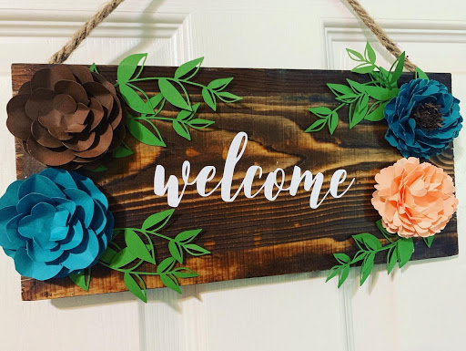 Paper flower wood welcome sign