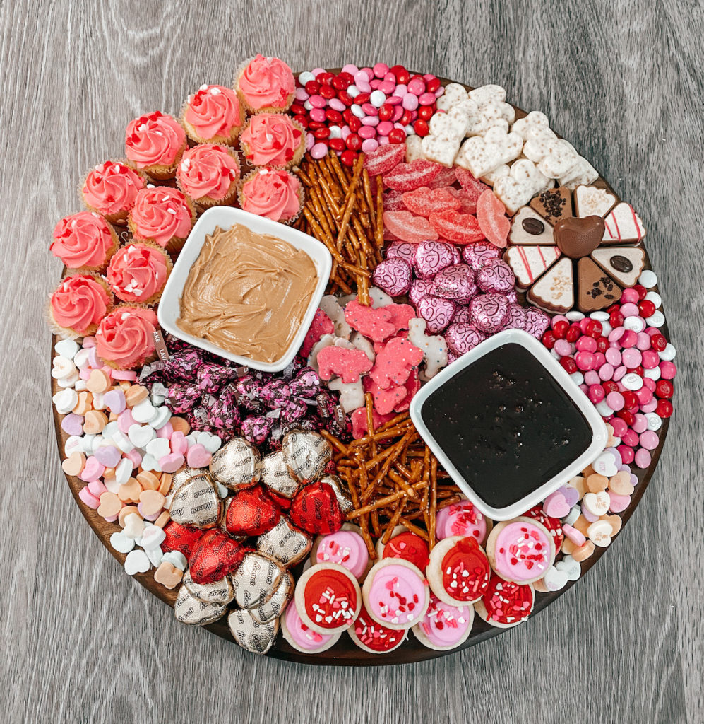 Charcuterie board with cookies and candy