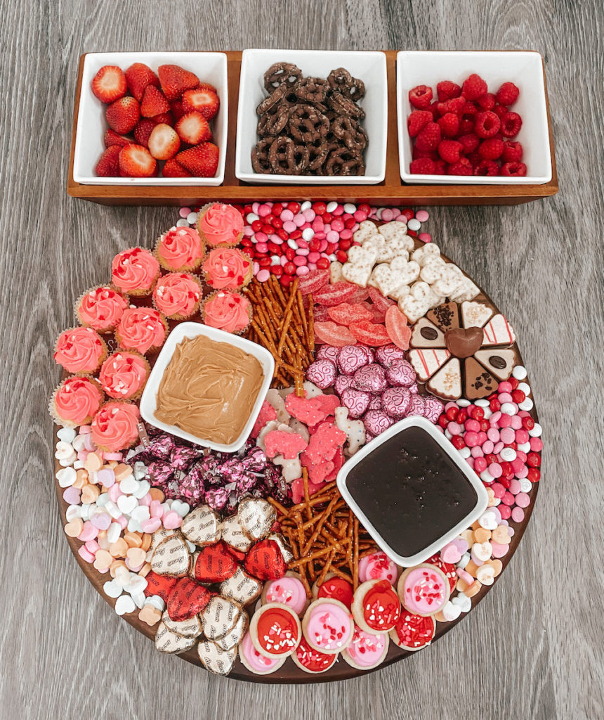 Charcuterie board with chocolates and treats