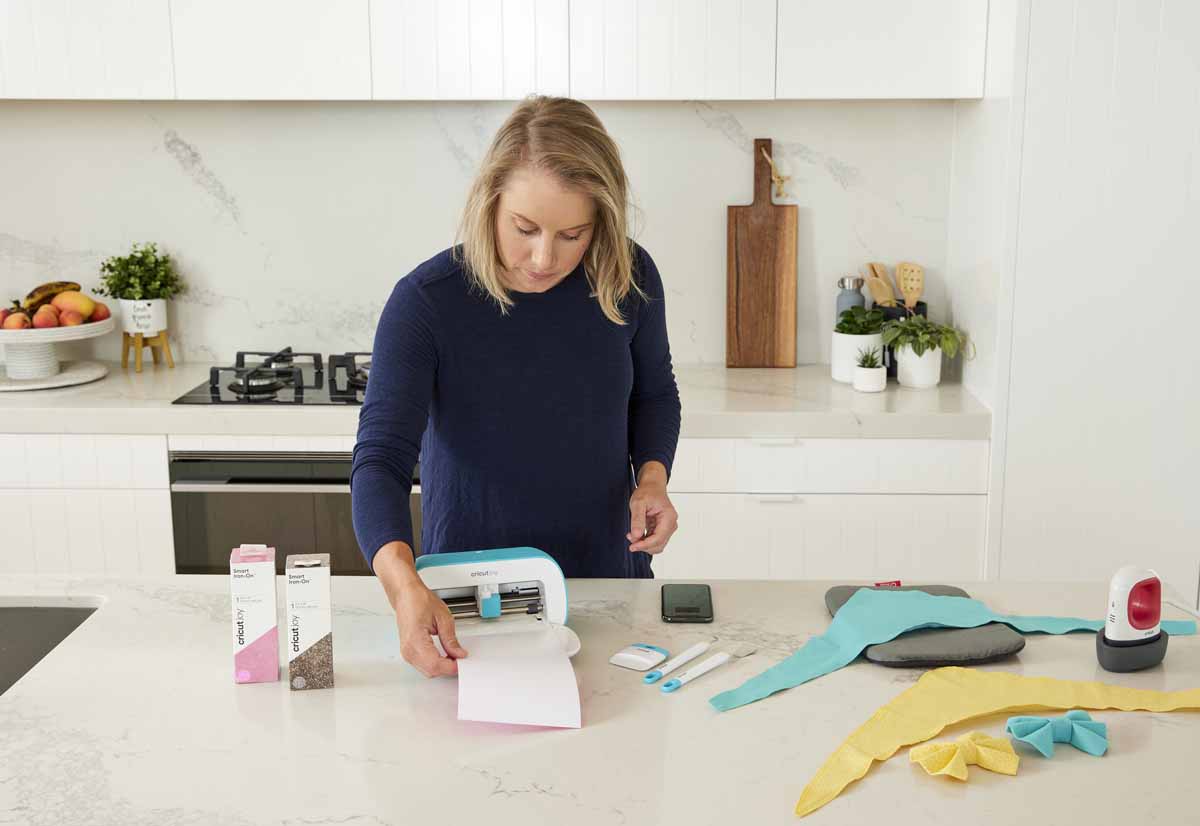 Cricketer Alyssa Healy making bandanas for her dogs with Cricut Joy