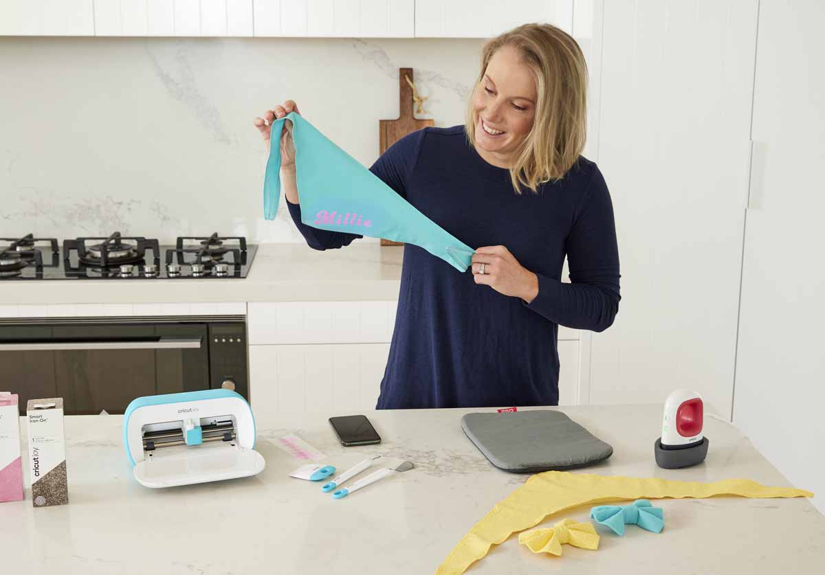 Cricketer Alyssa Healy making bandanas for her dogs with Cricut Joy