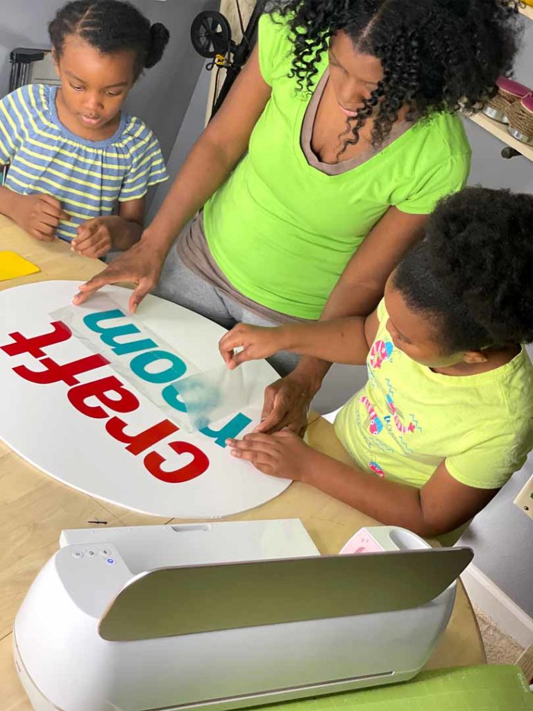 Artist Joey Johnson crafting with her daughters