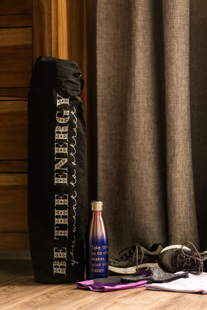 Yoga gear leaning up against bedroom dresser