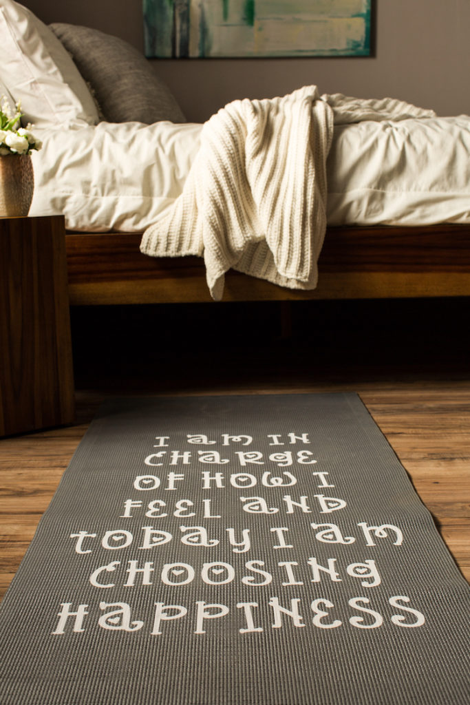 Unrolled yoga mat with words