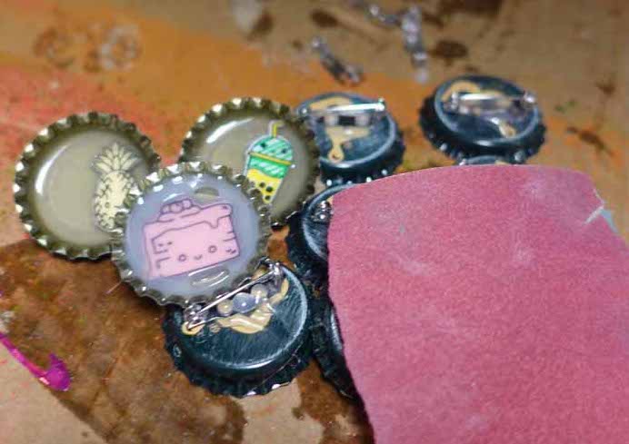 Bottle cap pins with Smart Labels and Smart Paper with sandpaper for texture