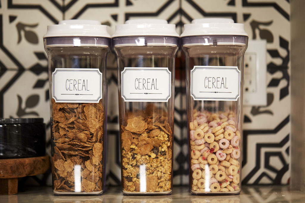 Cereal containers with custom Cricut labels.