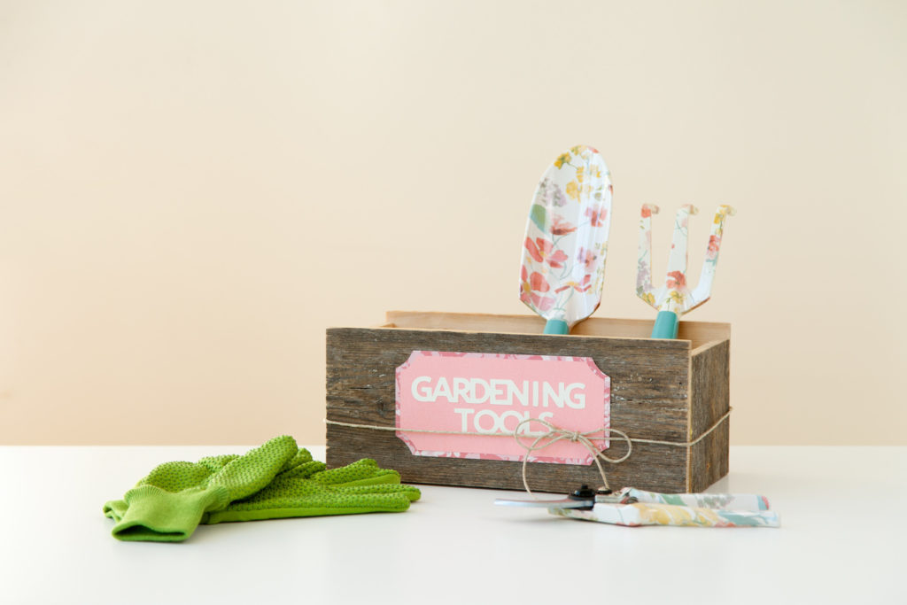 Gardening tools in labeled box