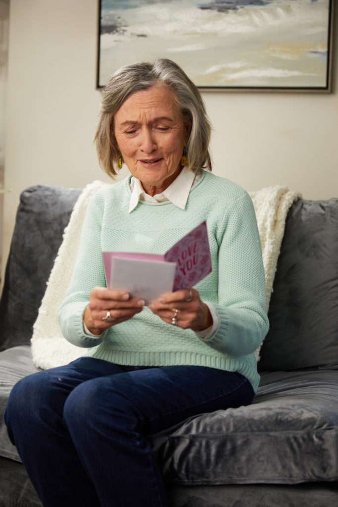 Grandma opening and reading card