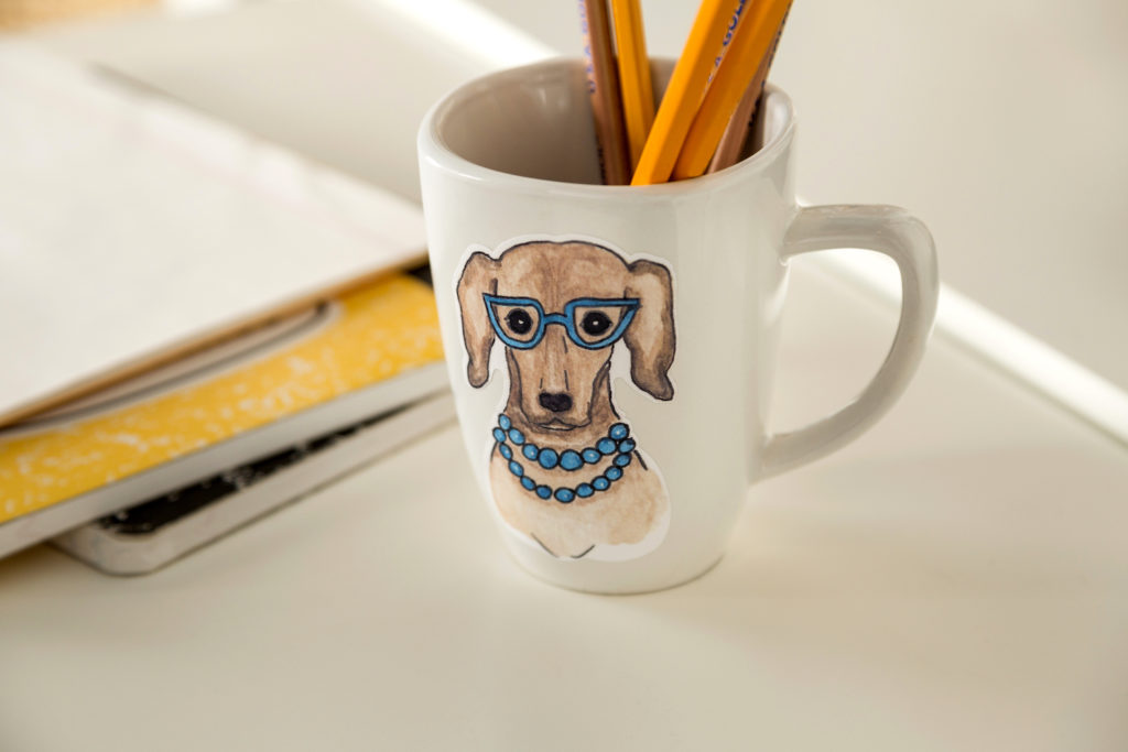 Portrait of a dog on a white mug
