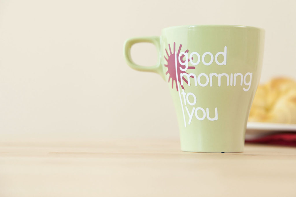 Mug that reads "good morning to you" sitting on table