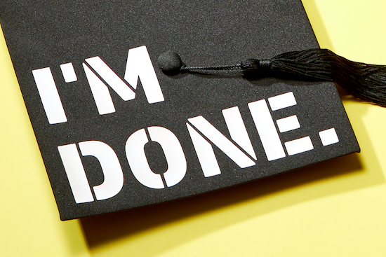 The words "I'm Done" printed on graduation cap