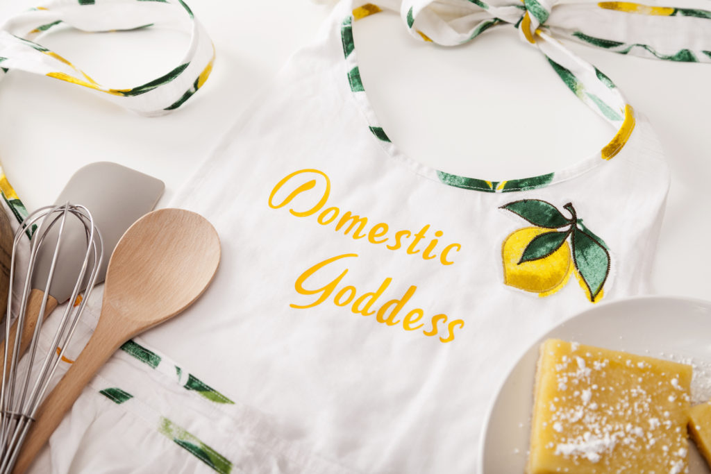 Homemade apron that reads "domestic goddess"