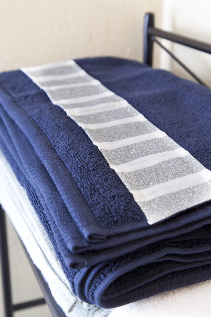 Glitter adorned bath towels