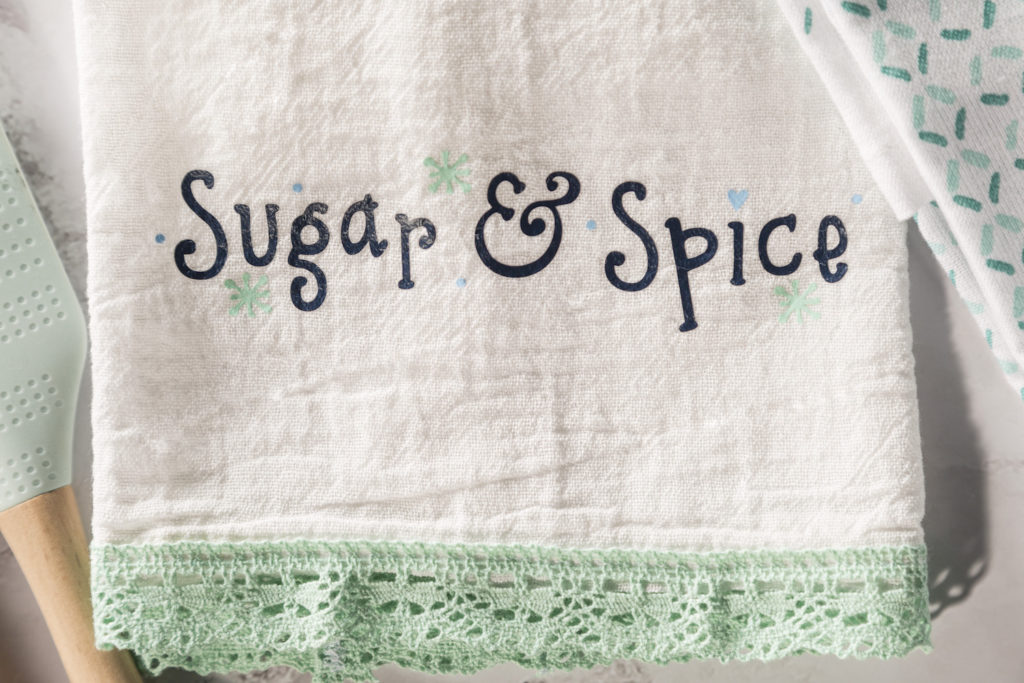 "Sugar & Spice" printed on tea towel