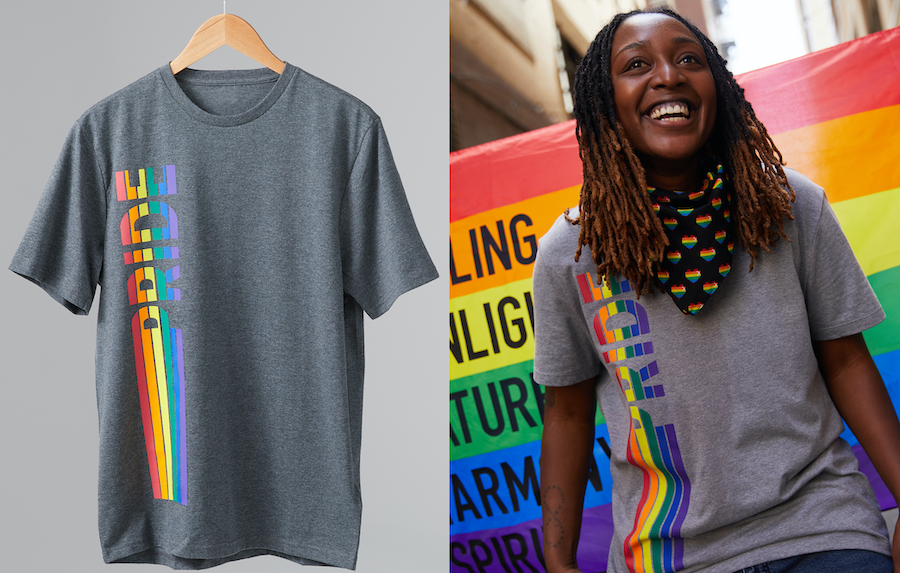 Pride Outfits. A rainbow t-shirt decal that reads "Pride" is being worn by a person standing and smiling in front of a Pride flag. 