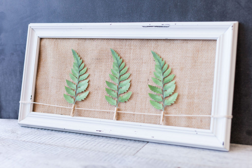 Organic Modern decor with 3 leaves framed with a burlap mat.