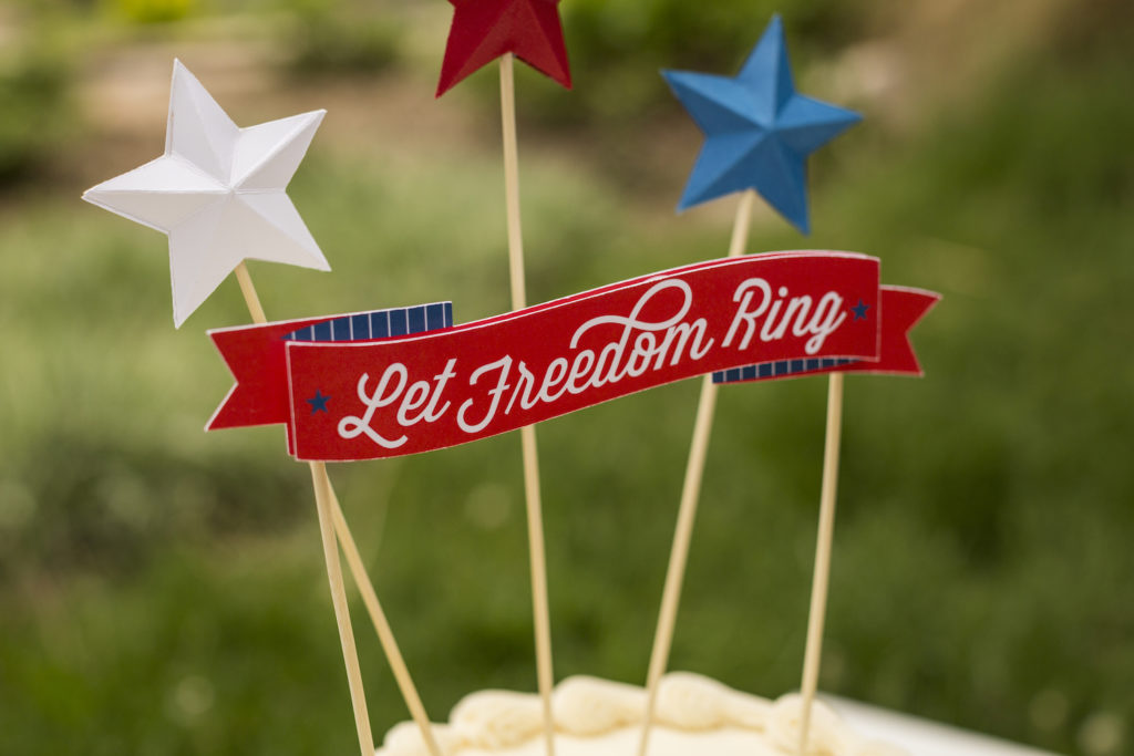 Fourth of July party favors "Let Freedom Ring" cake topper with patriotic stars