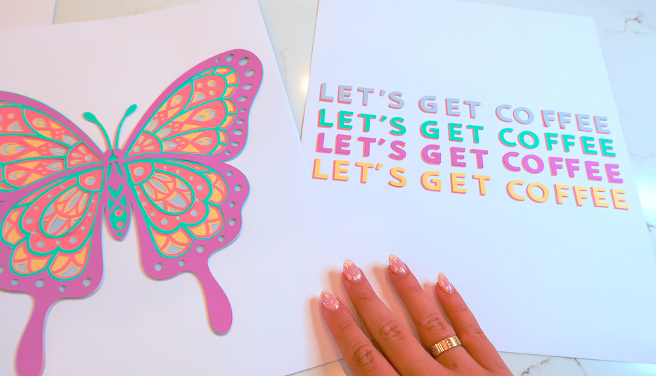 A hand displays two pastel colored pieces of dorm room decor made using Cricut Explore 3 machine
