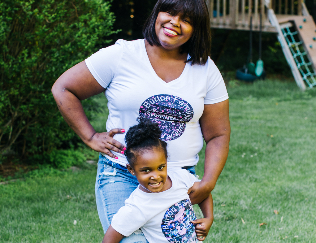 A mother and daughter wear matching custom tees, created with Cricut machines and materials for the perfect summer outfit