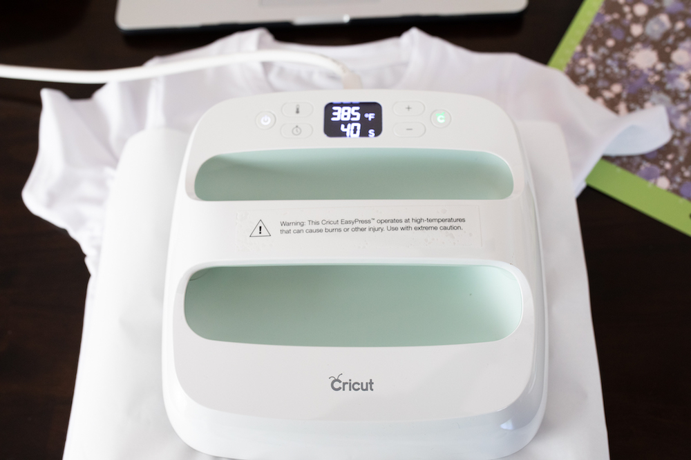 A Cricut EasyPress is used to press an ink design into a custom tee shirt used to create a unique summer outfit