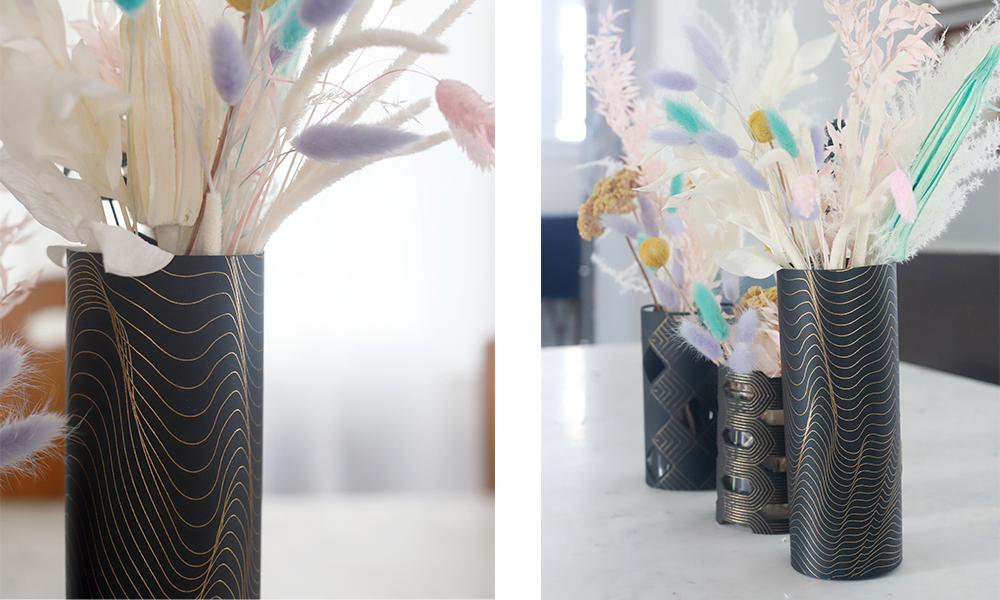 Detail shots showcase the gold foil patters on floral wedding centerpieces that sit in Cricut made black paper vase wraps