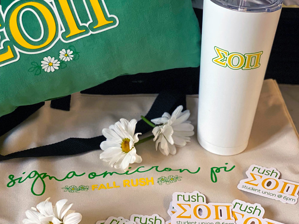 t-shirt, throw pillow, tumbler, tote, and stickers customized with Sigma Omicron Pi greek letters