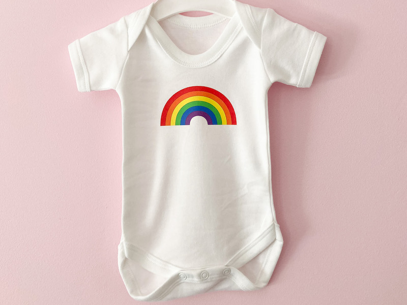 Baby onesie with rainbow design